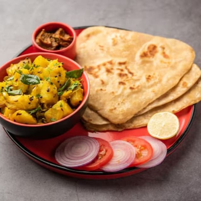 Porota, Naan or Ruti, Vaji or Dalmix & Cup of Tea.